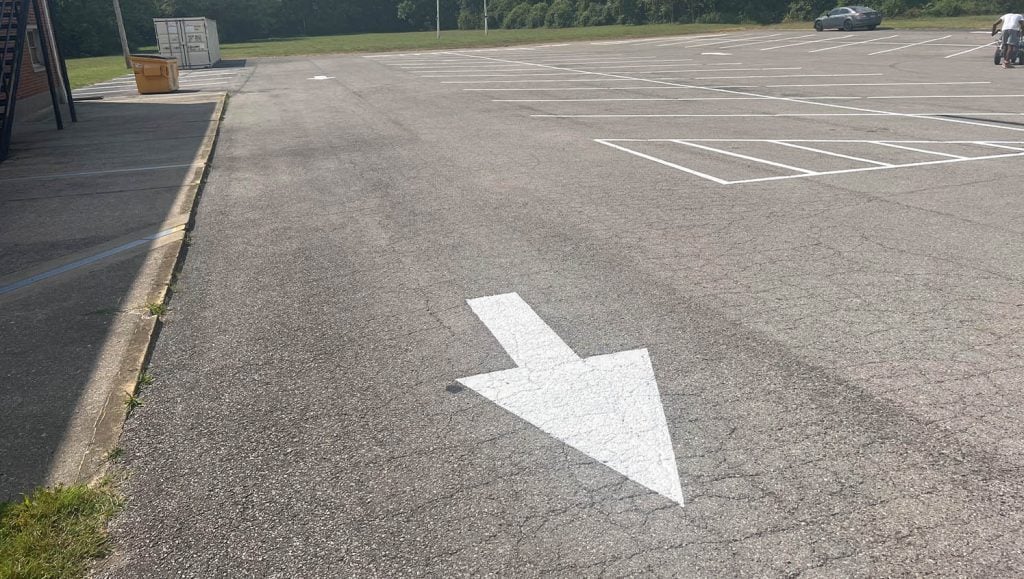 faded line markings at The Greater Faith Church of Deliverance parking lot
