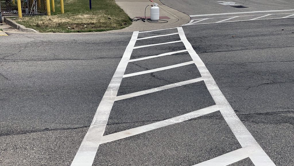re-striped thermoplastic crosswalk at medical center