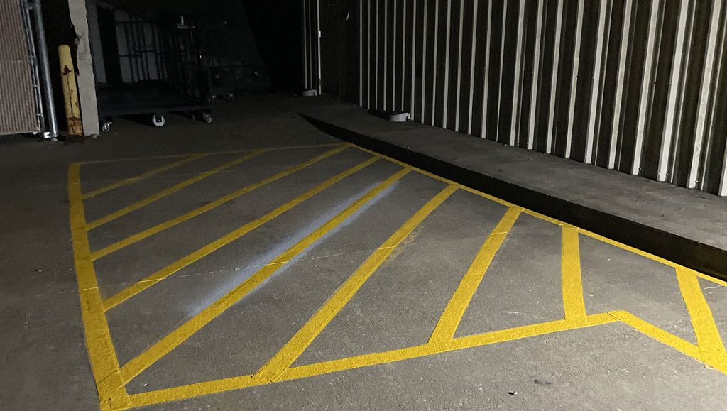 worn-out safety markings in parking lot