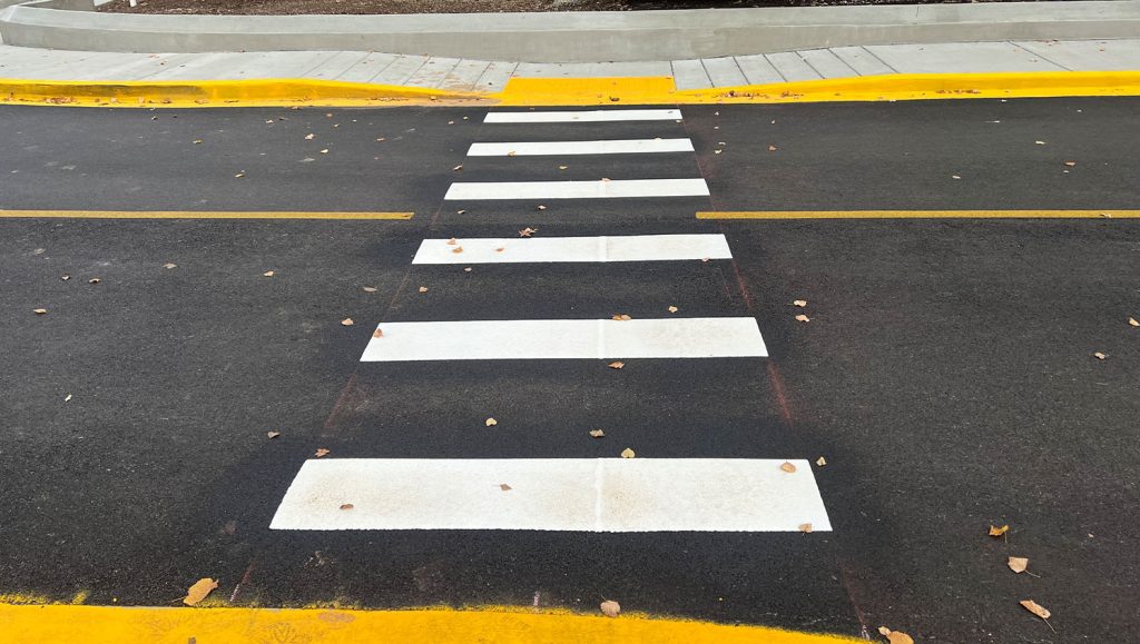 front view of freshly painted crosswalk for University of Kentucky Good Samaritan Hospital parking lot