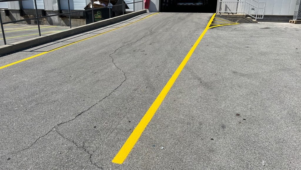 close-up of freshly painted yellow lines