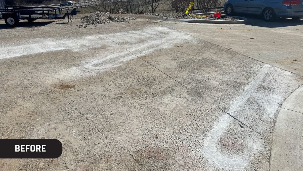 Kinemetrix parking lot with faded line markings