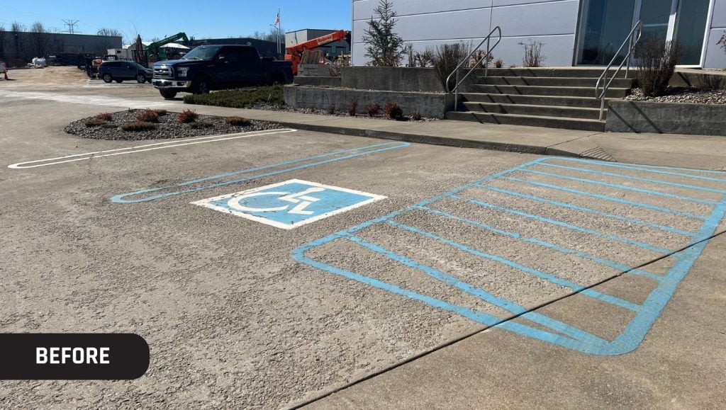 faded ada compliance parking spots at Kinemetrix