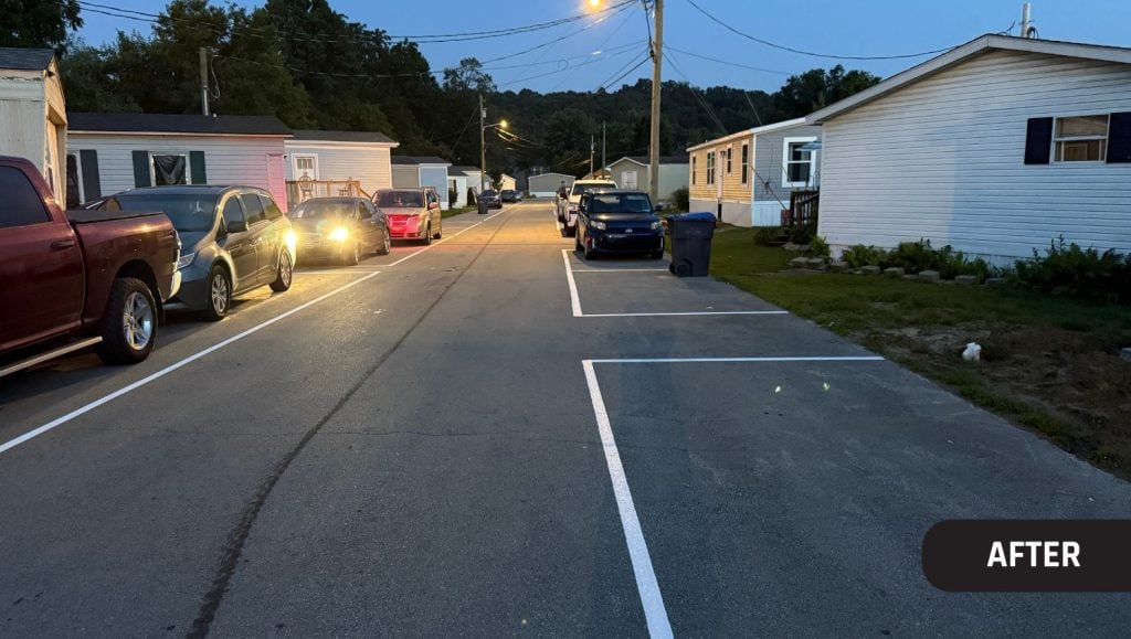 after portrait of Cardinal Mobile Home Park parking lot freshly painted