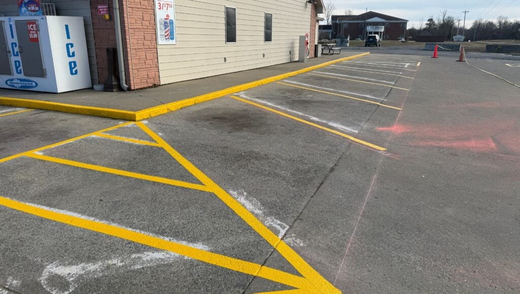 Casey’s Pizza Delivery parking lot freshly painted close-up