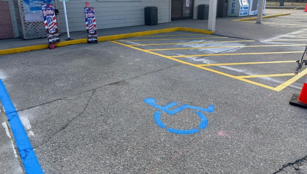 ada compliance parking spot freshly painted for Casey’s Pizza Delivery
