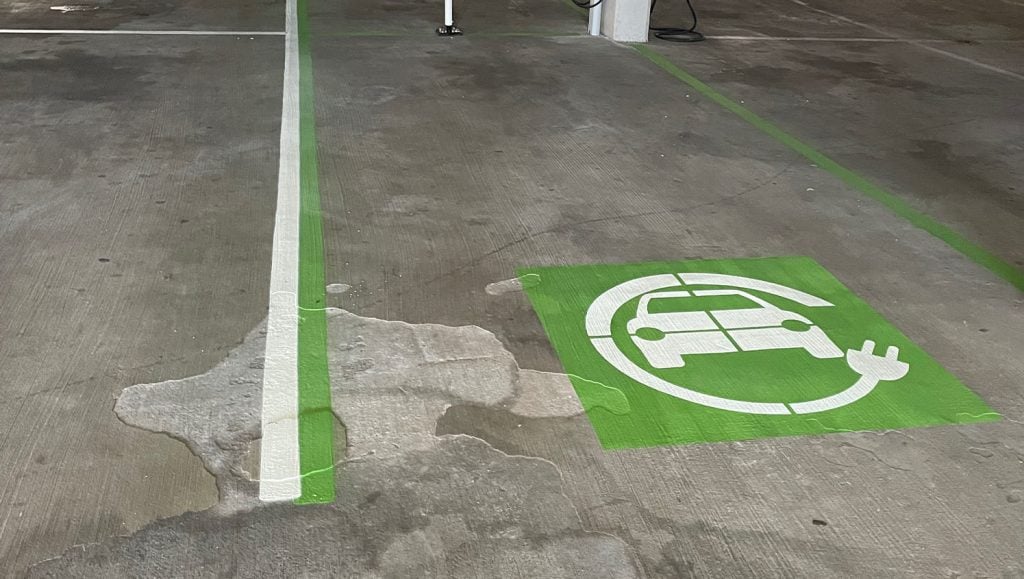 close-up of ev charging station parking spots freshly painted for Embassy Suites