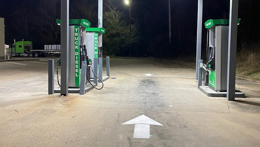 close-up of freshly painted white arrows for Circle K