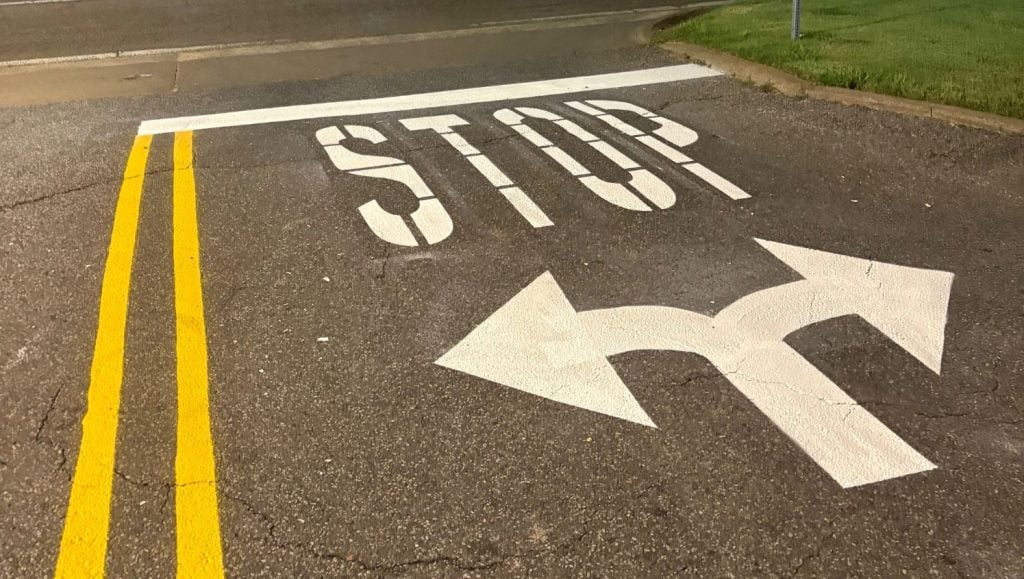 close-up of white line markings for Glide Express Car Wash parking lot