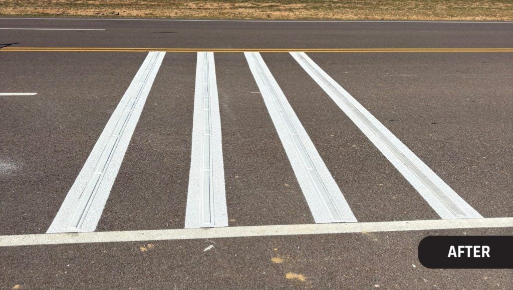 close-up of Ford Blue Oval City parking lot with freshly painted crosswalk