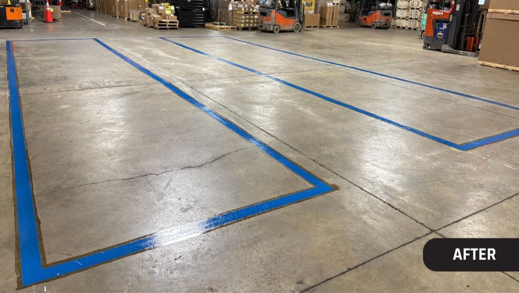 close-up of blue line markings freshly painted for Hunter Engineering warehouse