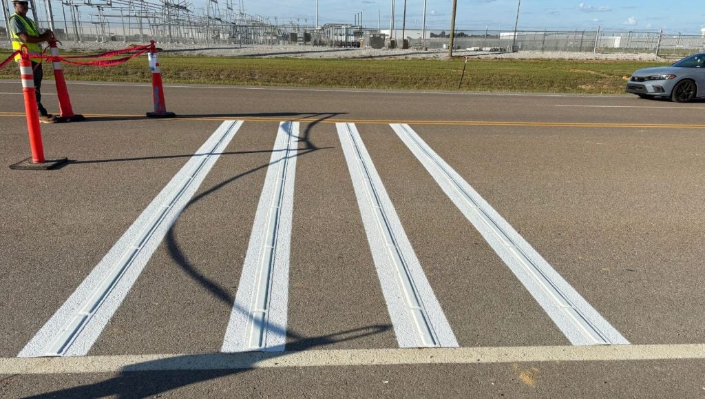 freshly painted line markings for Ford Blue Oval City parking lot