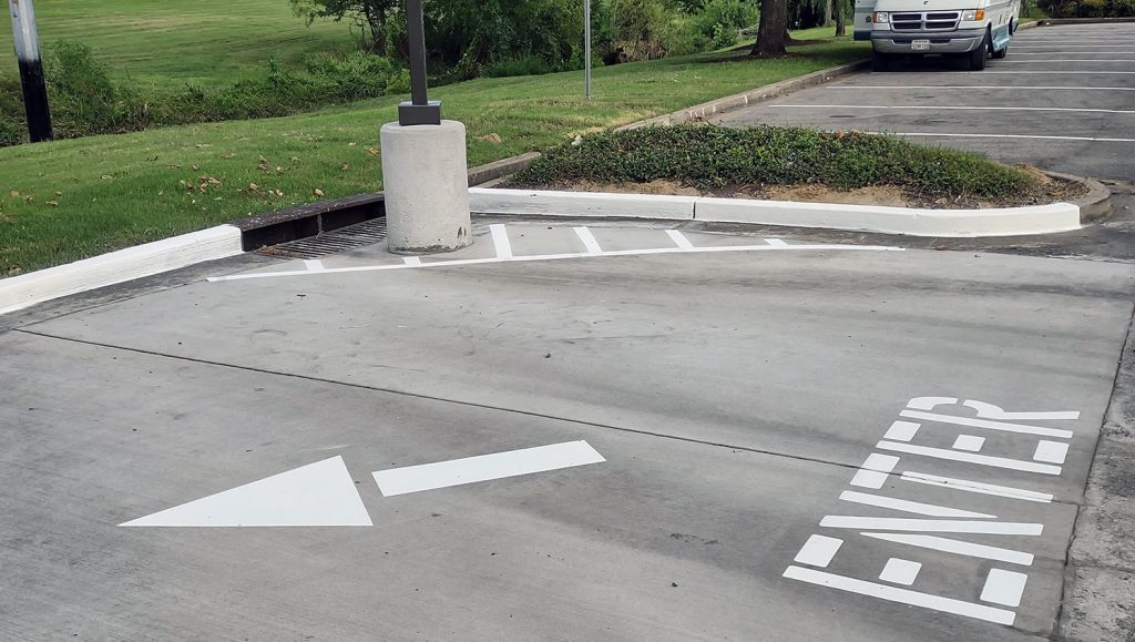 freshly painted bollards and curbing