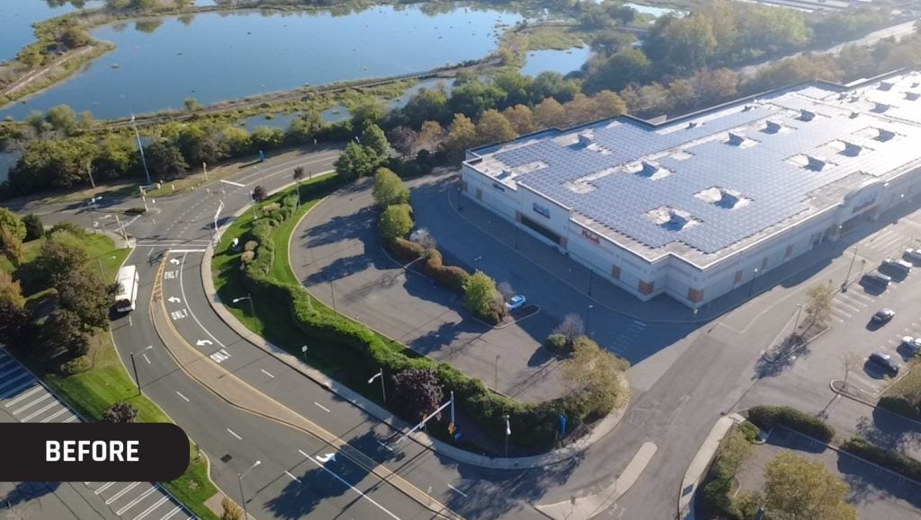 aerial view of Divisions Inc. parking lot before parking lot lines