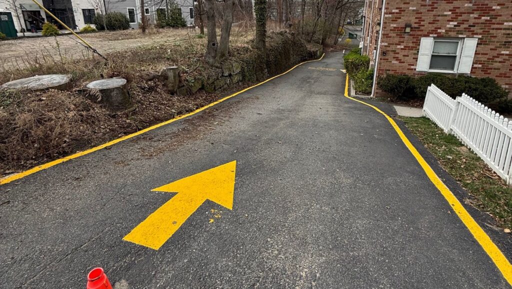 freshly painted arrows for Leonia Court parking lot