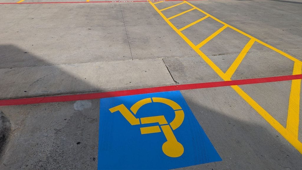 close-up of ada compliance parking spots freshly painted