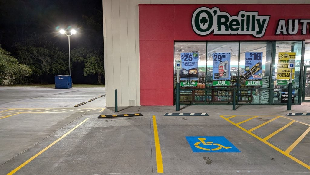 close-up of crosswalk freshly painted for O'Reilly Autoparts parking lot
