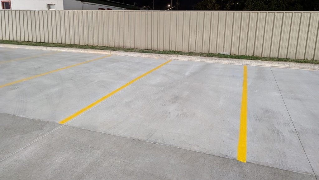 close-up of freshly painted parking spots for O'Reilly Autoparts