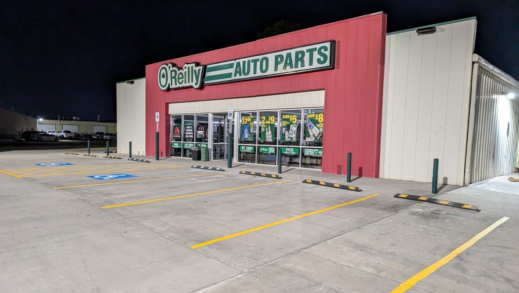 side view of O'Reilly Auto Parts parking lot freshly painted