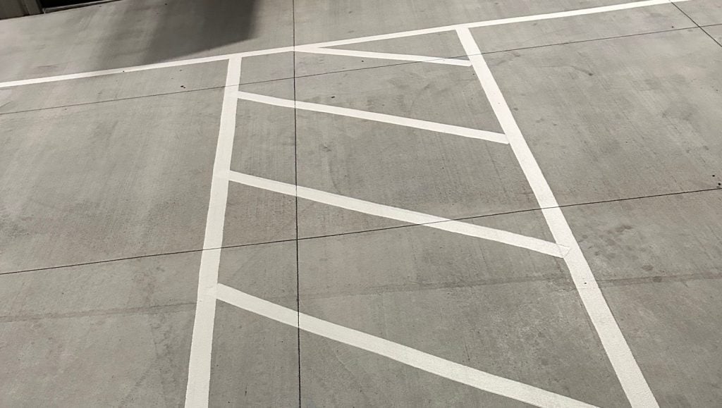 cross walk freshly painted on business park parking lot