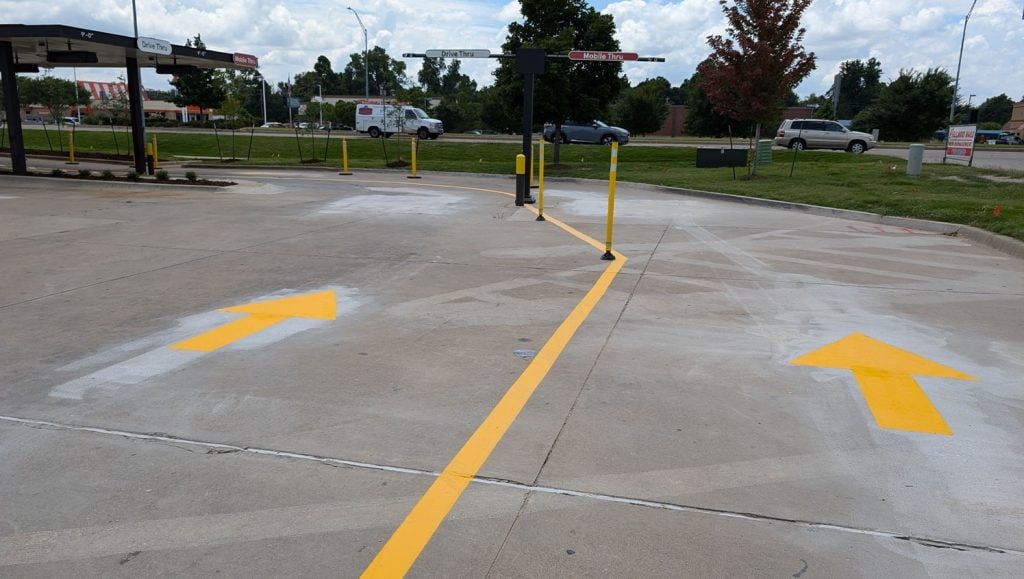 close-up of freshly painted line markings for Chick-fil-A parking lot