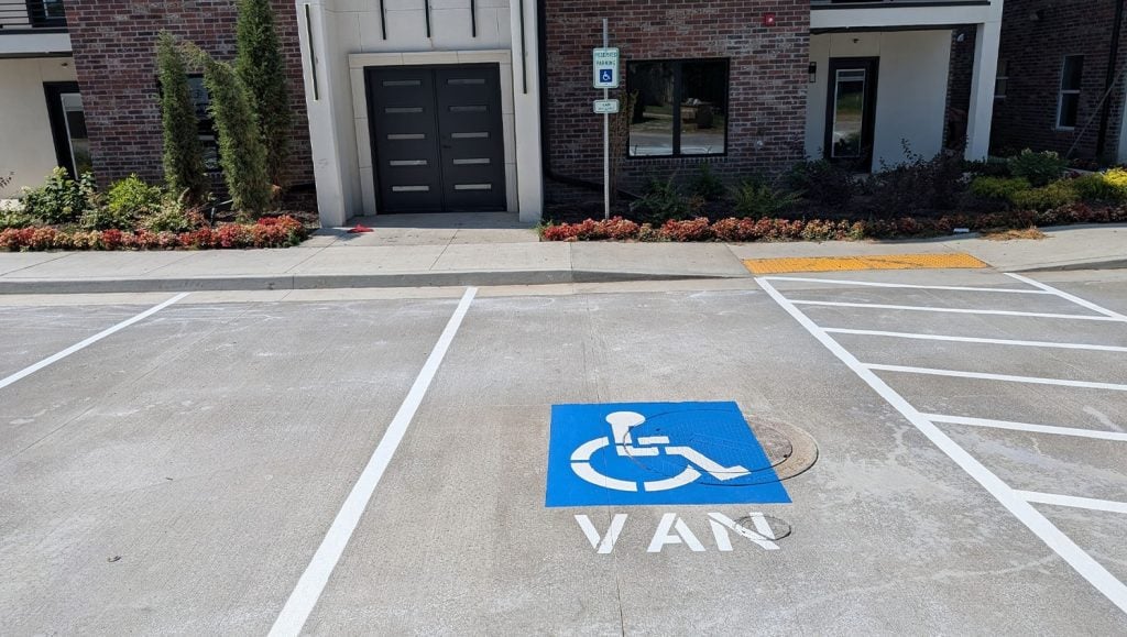close-up of freshly painted ada compliance parking spots for condo complex