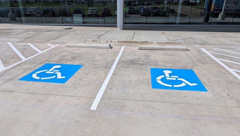 close-up of ada compliance parking spots freshly painted