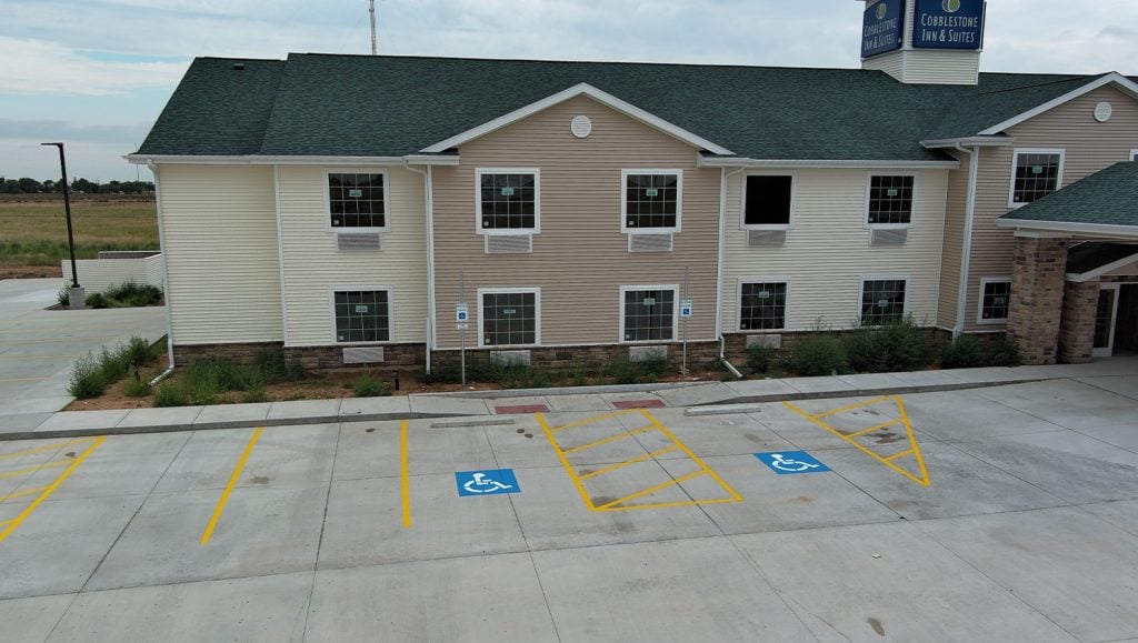 aerial view of Cobblestone Hotel parking lot with fresh painted parking spots