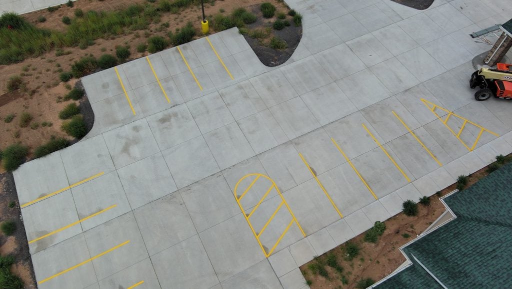 aerial view of Cobblestone Hotel parking lot with freshly painted lines