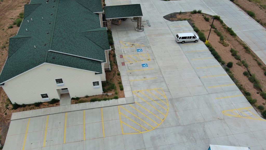 parking spots freshly painted for Cobblestone Hotel parking lot