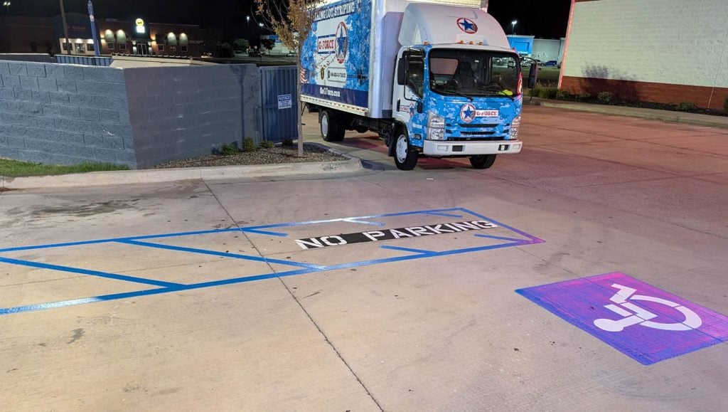 close-up of arrows painted on Dutch Bros parking lot