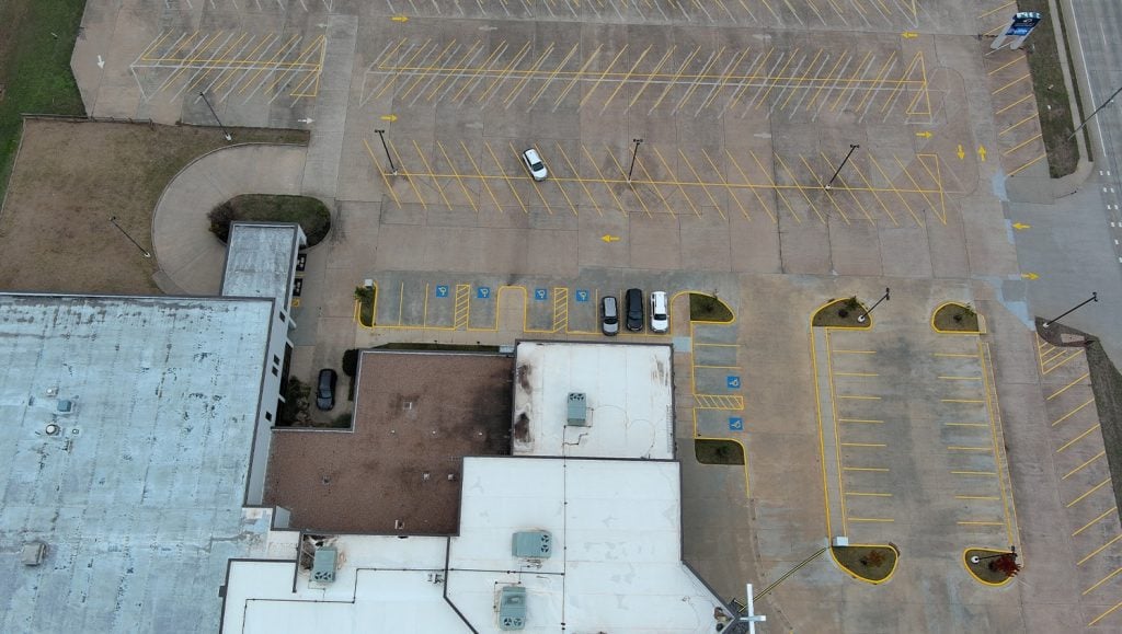aerial view of Owasso First Assembly Church freshly painted parking lot