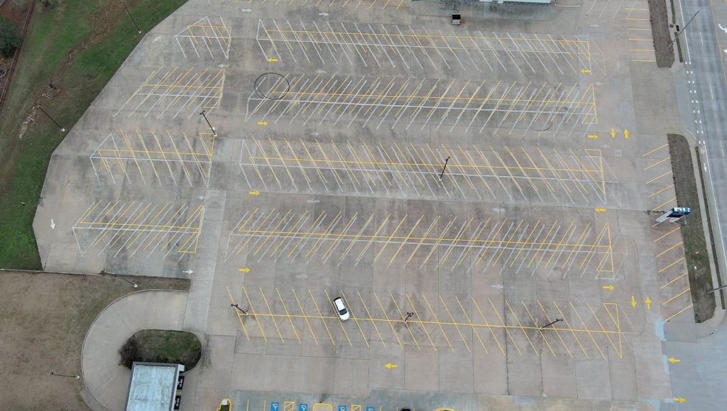 parking spots freshly painted for Owasso First Assembly Church aerial view