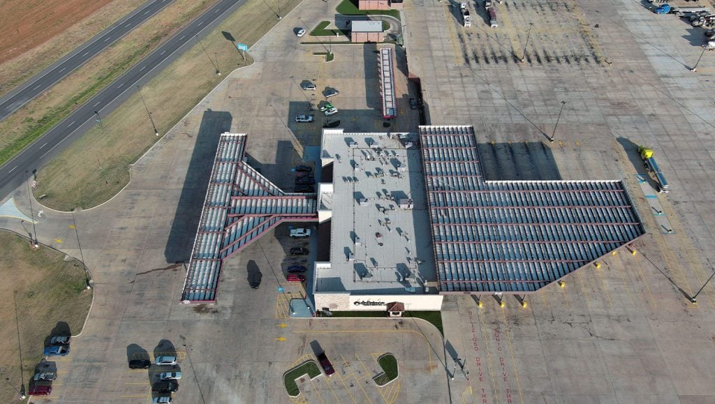 aerial view of Gore's Travel Plaza parking lot freshly painted