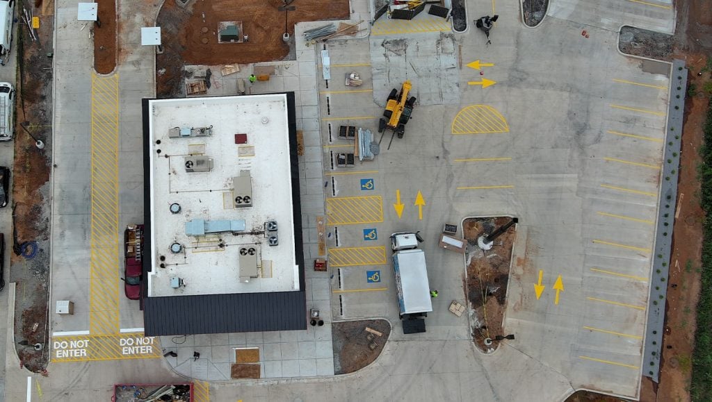 freshly painted line markings for panda express aerial view