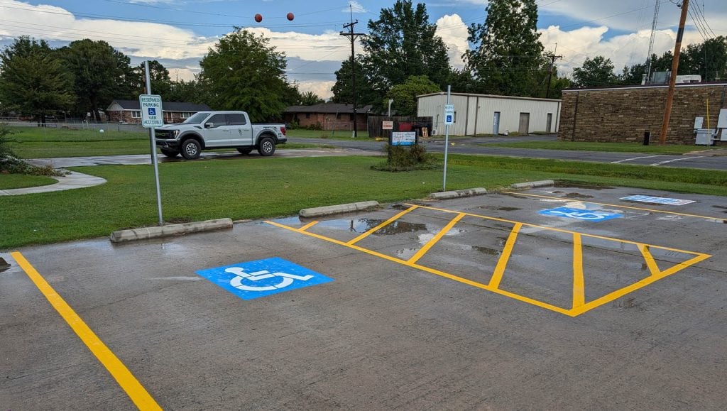 close-up of Stigler Primary Care Clinic parking lot with freshly painted line markings