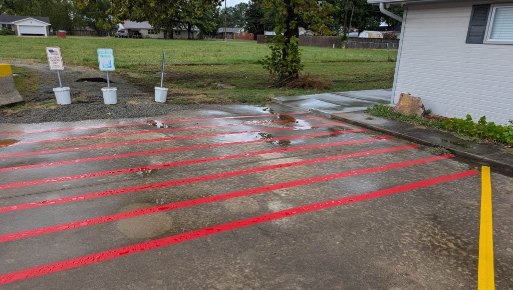 close-up of freshly painted red line markings for Stigler Primary Care Clinic