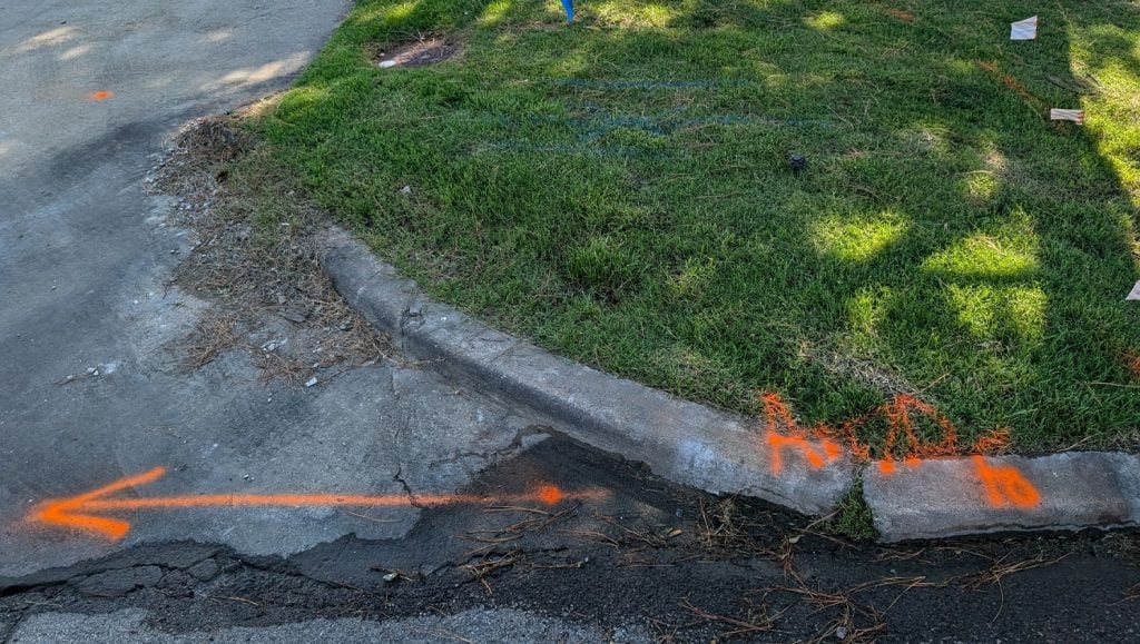 close-up of freshly painted yellow bollards