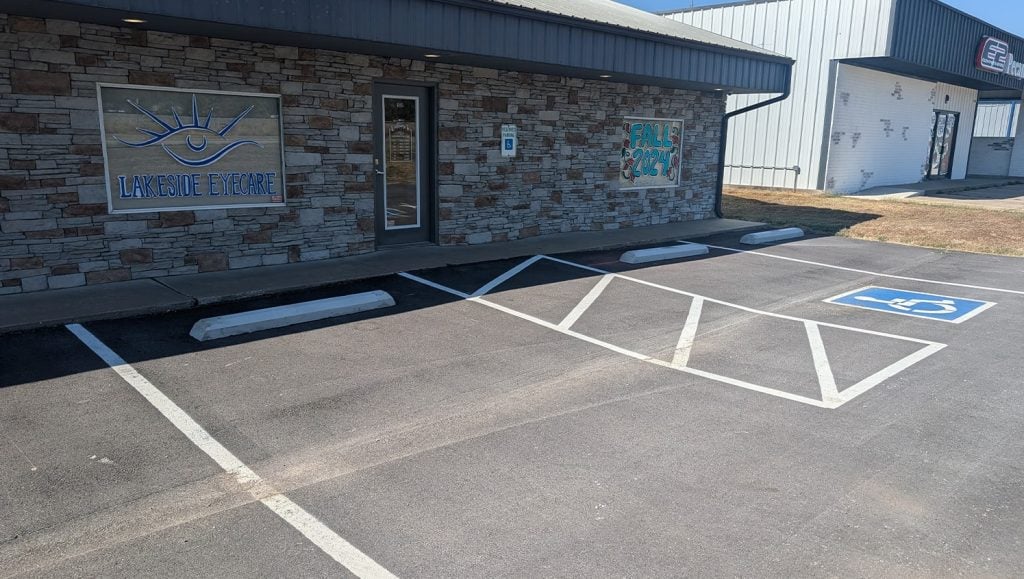 close-up of parking stops installation for Lakeside Eyecare