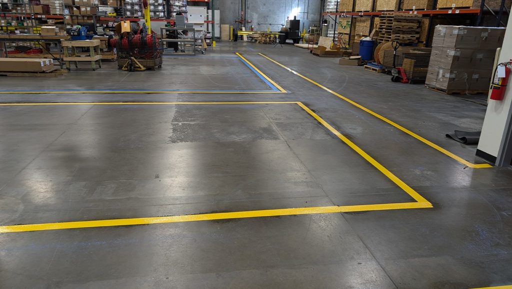 interior view of warehouse with freshly painted line markings