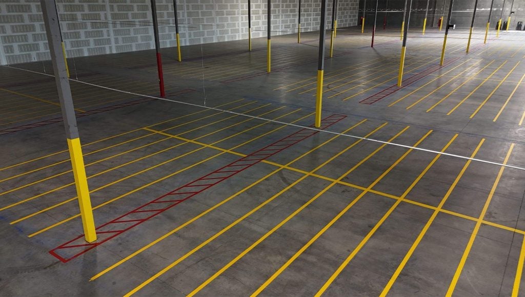 warehouse floor markings freshly painted for DART Entities aerial view