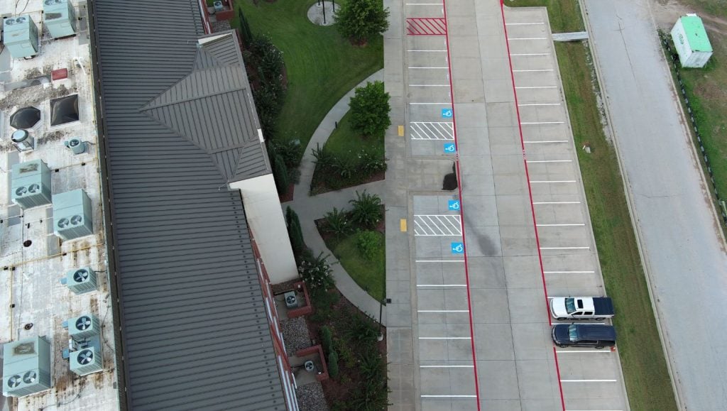 ada compliance parking spots freshly painted for Gateway Mortgage parking lot aerial view