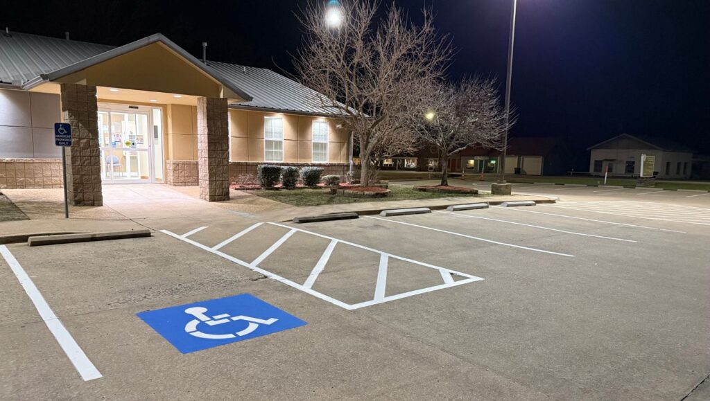 Talihina Tribal Services parking lot with freshly painted ada compliance parking spot