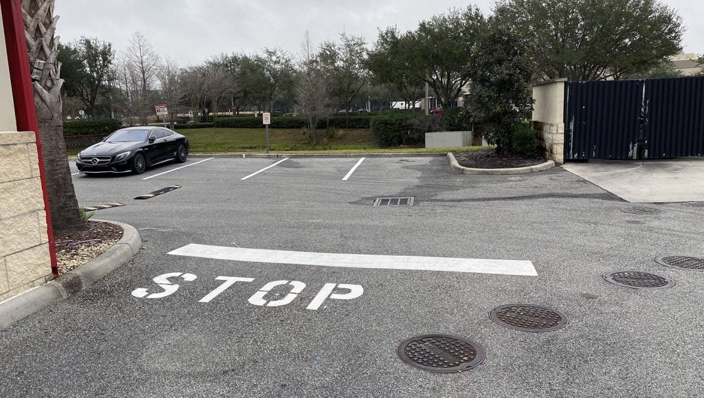 forward view of restriped parking stalls at a Freddy’s Frozen Custard & Steakburgers in Orlando, FL