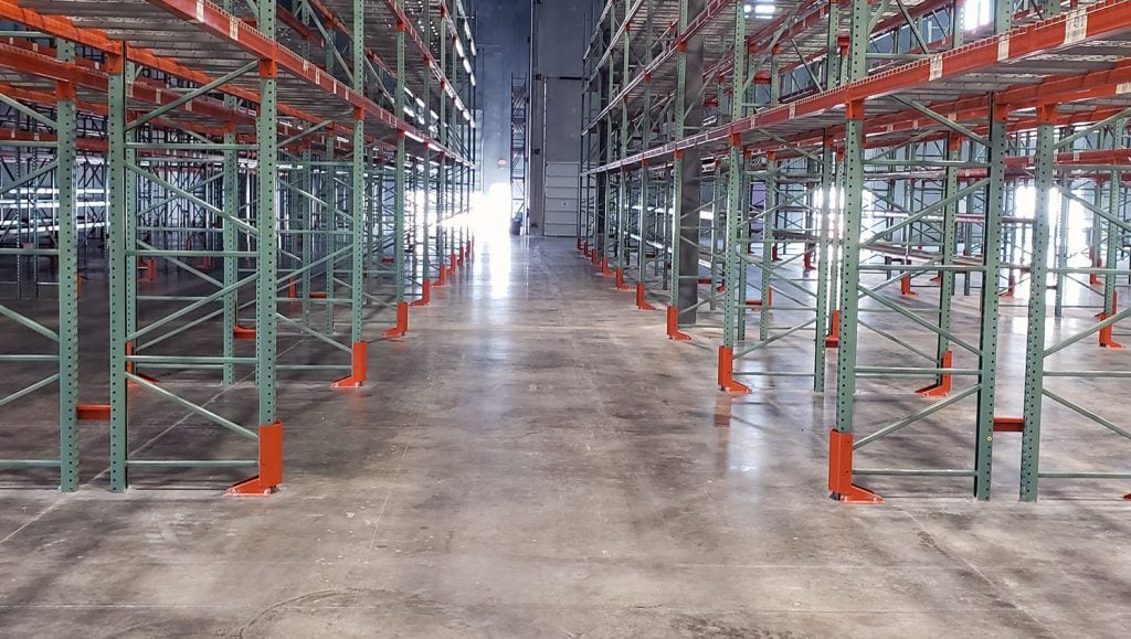 empty warehouse aisle before striping
