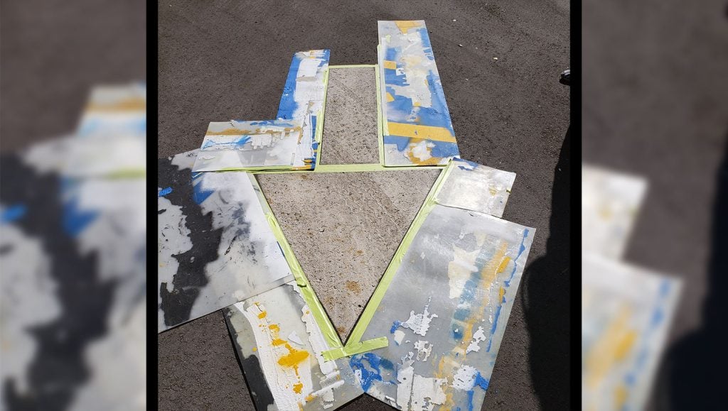 stencil awaiting fresh line striping in parking lot