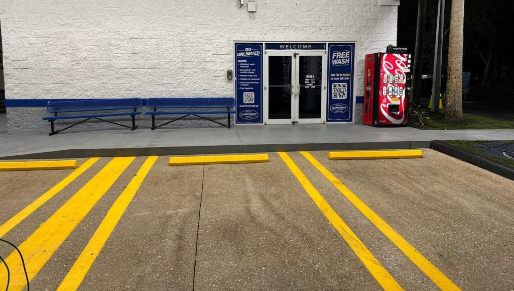 parking spots freshly painted for Clean Wave Car Wash parking lot