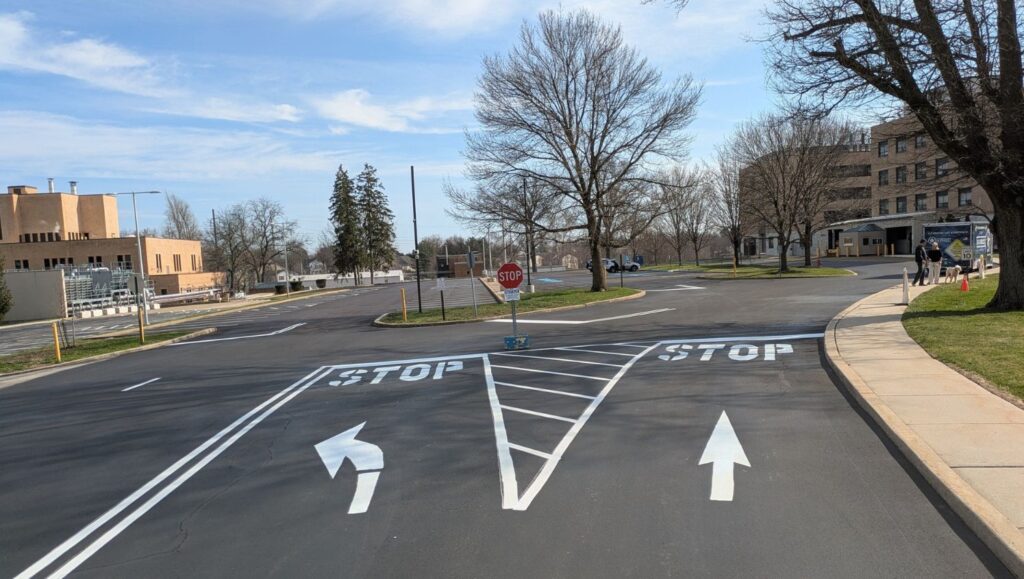 white arrows freshly painted for Eastern Regional Research Center parking lot