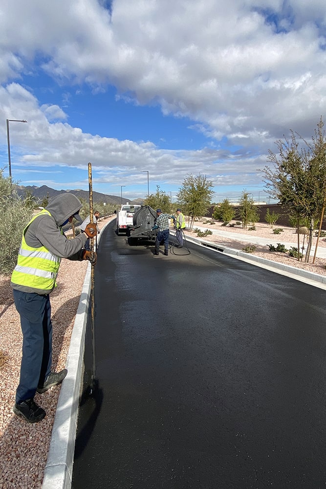G-FORCE™ crew members in the process of sealcoating a Buckeye, AZ street