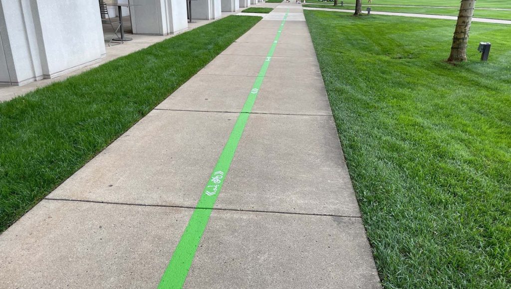 close-up of green freshly painted line markings for Carnegie Mellon University
